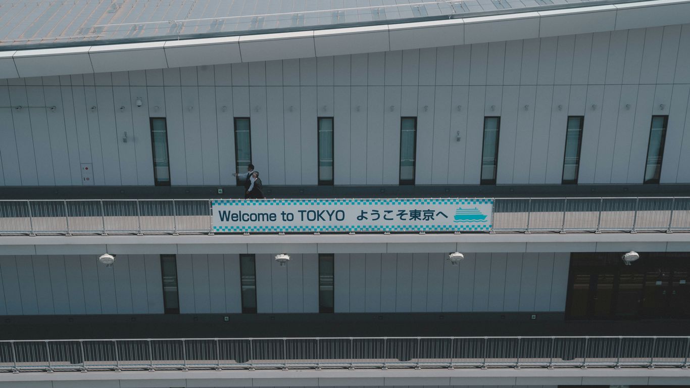 a building with a sign that says welcome to tokyo